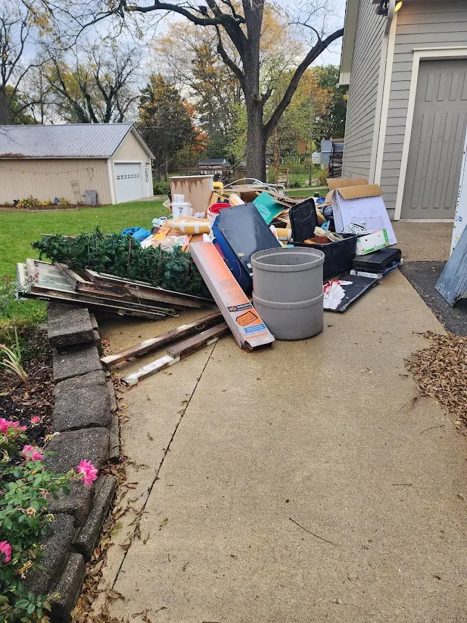 Dumpster being loaded with debris for Estate Cleanout Dumpster Rental in Good Hope